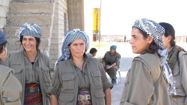 Commander Nuve Rojhat (centre) with some of the fighters in her unit at the Daquq PKK base.