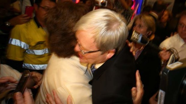 Prime Minister Kevin Rudd is embraced by supporters after he addresses the Unions NSW rally in Mt Druitt, Sydney, on Friday.