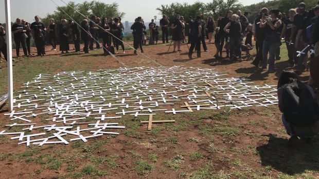 Protesters lay cross symbols on the ground during a demonstration by South African farmers and farm workers at the Voortrekker monument in Pretoria last October.