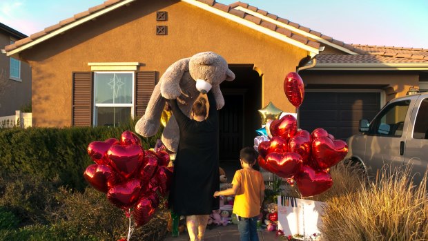 Neighbours drop off his large teddy bear as a gift for the children who lived at the Turpin home when the story first broke.