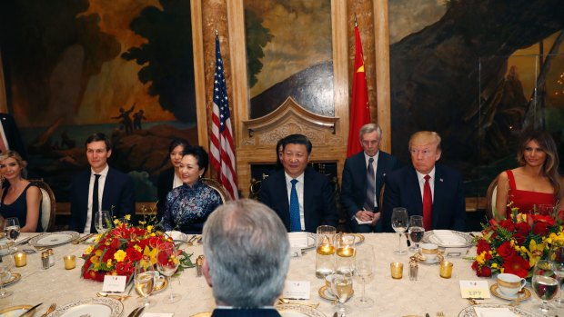 US President Donald Trump and Chinese President Xi Jinping, with Ivanka Trump at far left, at dinner at Mar-a-Lago last year.
