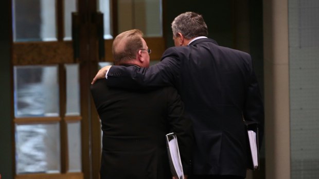 Small Business Minister Bruce Bilson and Treasurer Joe Hockey depart question time on Wednesday.