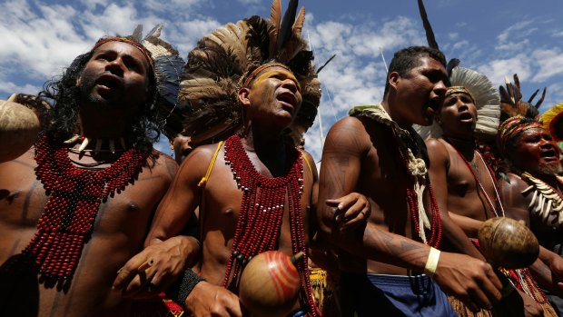 Brazilian Indigenous people from various ethnic groups take part in a protest against the government's land demarcation policies.