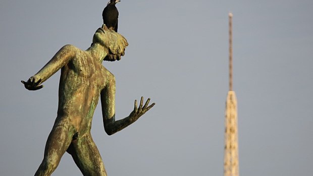 A cheeky magpie checks out the lay of the land from The Hand of God statue at the Sidney Myer Music Bowl.