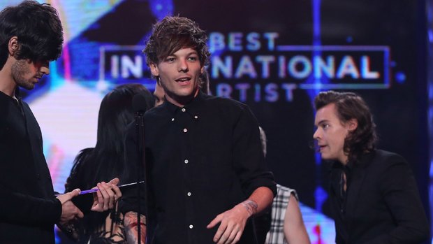 One Direction accepts the ARIA for best international act.