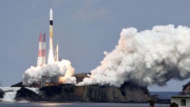 In this Wednesday, Dec. 3, 2014 photo, an H2-A rocket carrying space explorer Hayabusa2 lifts off from a launching pad at Tanegashima Space Center in Kagoshima, southern Japan.