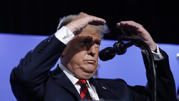 Seeing increases everywhere: US President Donald Trump shield his eyes from stage lights as he take questions from members of the media during a news conference before departing the NATO Summit in Brussels.