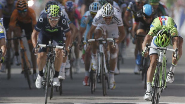 Australia's Simon Gerrans, left, crosses the finish line ahead of Peter Sagan of Slovakia, right, to win the third stage of the Tour de France in 2013.