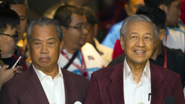 Mahathir Mohamad, right, speaks to media at a hotel in Kuala Lumpur, Malaysia, Wednesday.