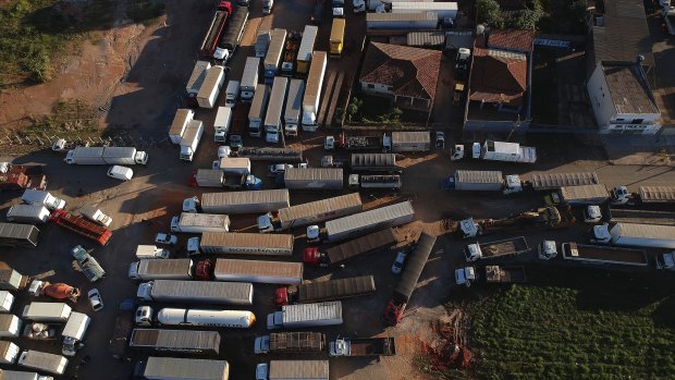 Trucks sit idle during a truckers strike in Brasilia on Friday.