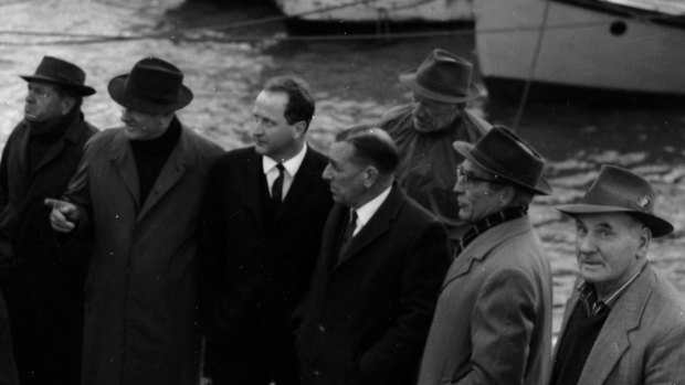Fishermen meet with Labor leader, Mr Holding, and Senator George Poyser (both hatless) at the St Leonards pier.