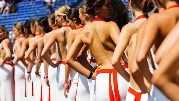 Grid girls were supposed to disappear from Formula One this year, but sponsors are sneaking them back.