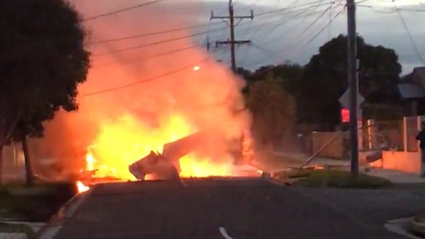 The plane caught fire after the crash on the residential street late on Friday afternoon.