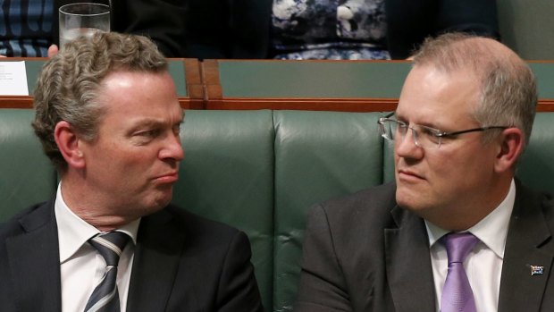 Leader of the House Christopher Pyne and Social Services Minister Scott Morrison in discussion during question time on Thursday.