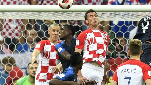 Croatia's Mario Mandzukic scores at the wrong end.