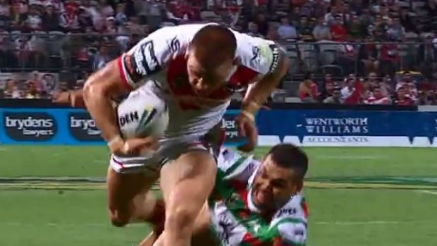 Stood up: Euan Aitken gets one over Greg Inglis.