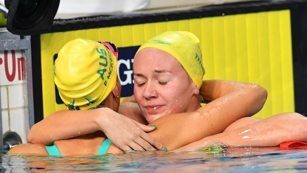Ariarne Titmus hugs Emma McKeon after winning silver and bronze respectively in the 200m freestyle.