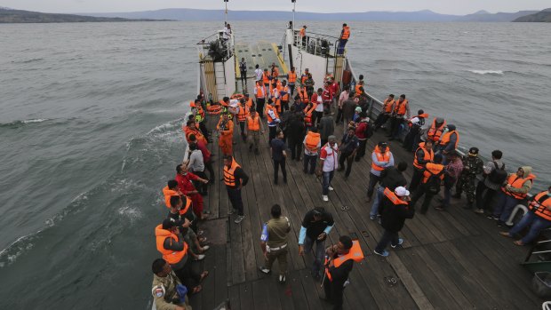 An Indonesia search and rescue team searches for a ferry which sank in Lake Toba, Sumatra.