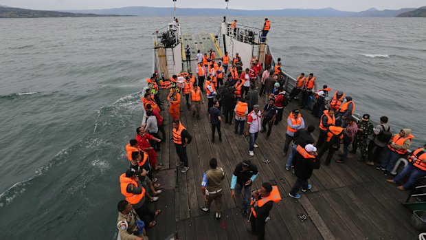 An Indonesia search and rescue team searches for a ferry which sank in Lake Toba, Sumatra.