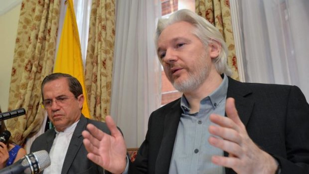 Not much happening: Julian Assange (right) and Ecuadorian Foreign Minister Ricardo Patino address media on Monday at the Ecuadorian embassy.