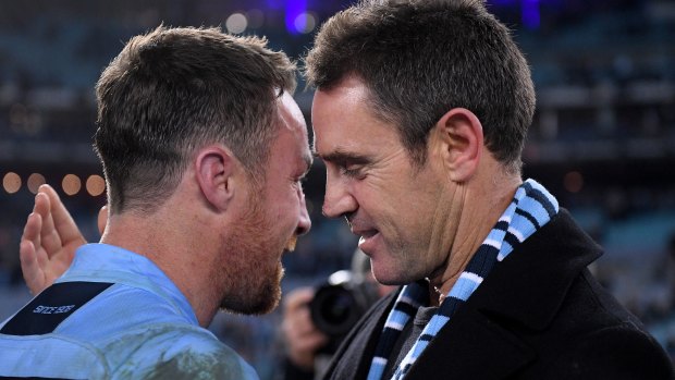 Emotional: James Maloney and coach Brad Fittler after the win.
