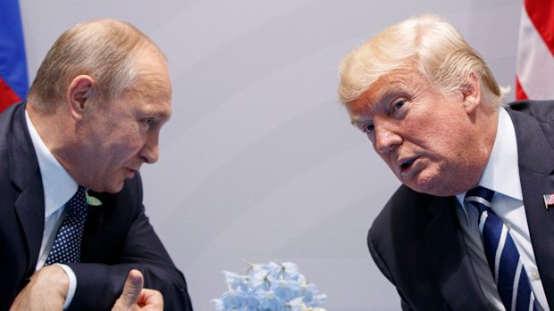 Donald Trump, here with Vladimir Putin at the G20 Summit in Hamburg last year, said he believed Putin when Putin said he didn't do it.