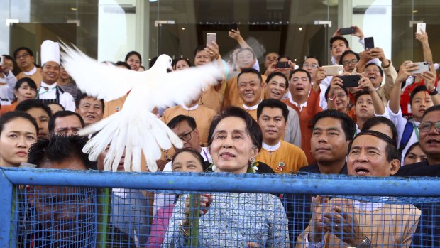 Myanmar's leader Aung San Suu Kyi, centre, releases a white dove  on her birthday last week.