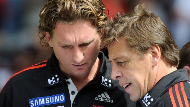 James Hird and Bomber Thompson working together in 2011. 