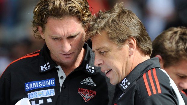 James Hird and Bomber Thompson working together in 2011. 