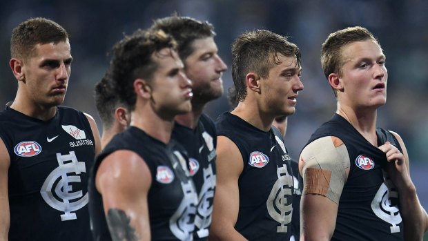 Patrick Cripps (second from right) of the Blues leads his players from the ground. The Blues don't want a priority pick, they're backing their current talent. 