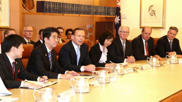 Prime Minister Tony Abbott and Japanese Prime Minister Shinzo Abe during a Cabinet room meeting at Parliament House on Tuesday. Photo: Alex Ellinghausen