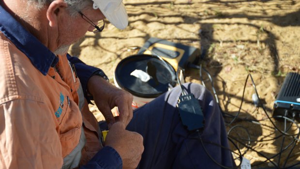 An engineer connects a "snot box" to the network.