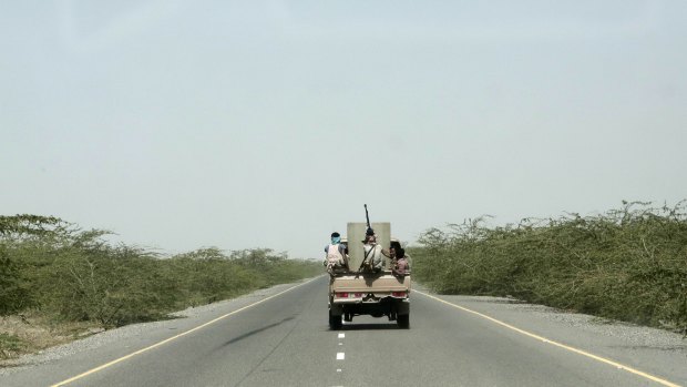 Saudi-backed forces ride in their vehicle, in Hodeida, Yemen.