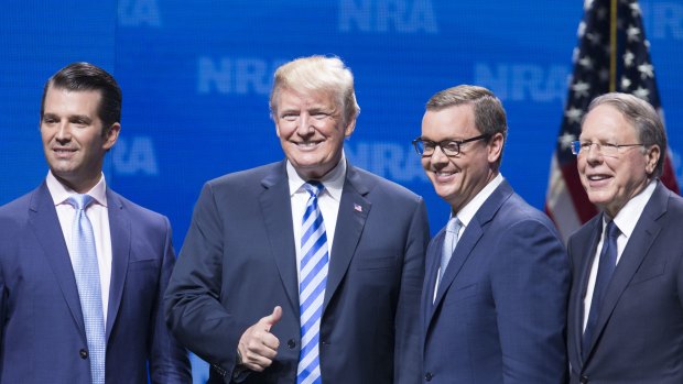 Donald Trump Jr and President Donald Trump with Chris Cox, chief lobbyist of the National Rifle Association (NRA), and Wayne LaPierre, chief executive officer of the NRA.