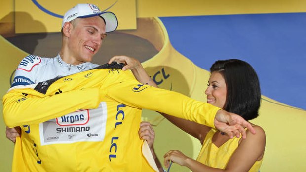 Marcel Kittel of Germany and Argos-Shimano puts on the yellow jersey after winning stage one of the 2013 Tour de France.