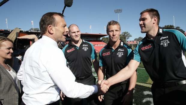 Opposition leader Tony Abbott meets with Penrith Panthers players, in Penrith, NSW, on Tuesday.