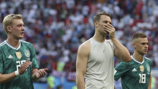 Shock loss: Germany's Julian Brandt, left, goalkeeper Manuel Neuer, and Joshua Kimmich. 