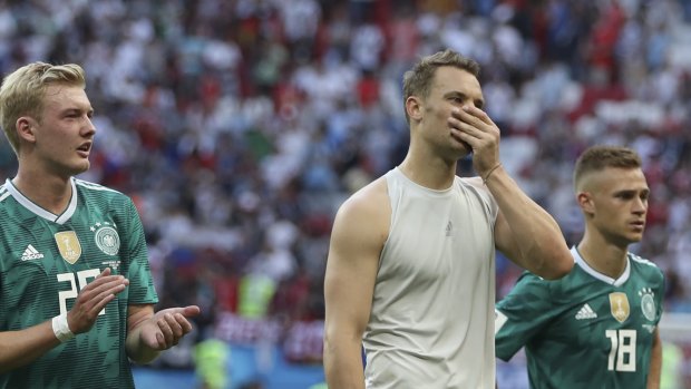 Shock loss: Germany's Julian Brandt, left, goalkeeper Manuel Neuer, and Joshua Kimmich. 