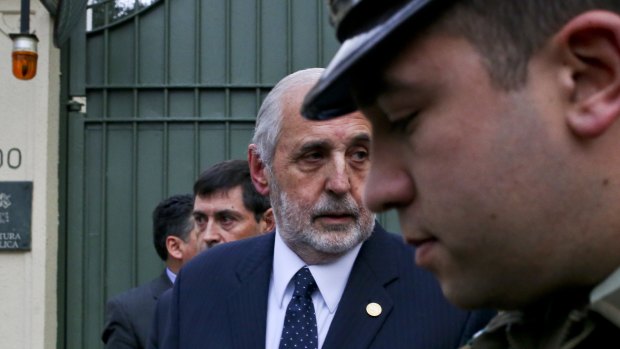 Chilean Attorney-General Jorge Abbott, centre, leaves the Apostolic Nunciature after meeting with Archbishop Charles Scicluna in Santiago on Wednesday.