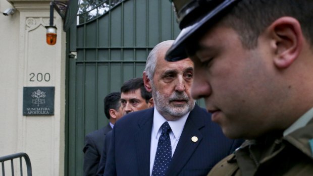 Chilean Attorney-General Jorge Abbott, centre, leaves the Apostolic Nunciature after meeting with Archbishop Charles Scicluna in Santiago on Wednesday.