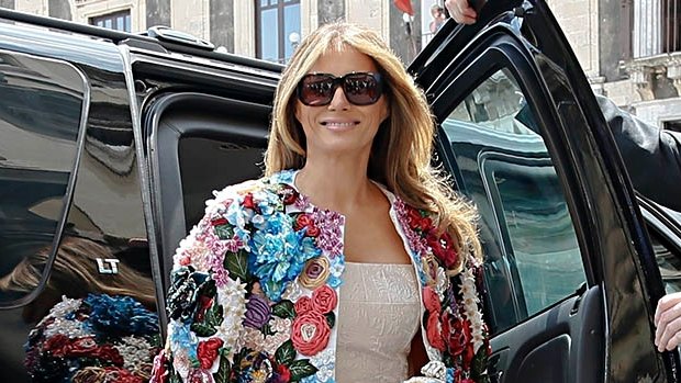 Misreading the mood ... Melania Trump, in a $70,000 Dolce & Gabbana jacket, attending an economic summit in Italy. 