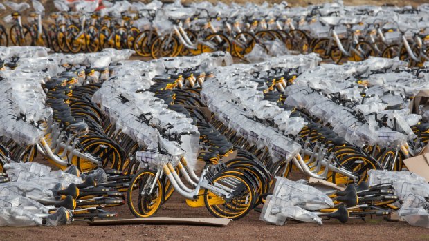 Thousands of bikes sit in an empty lot in Nunawadding. oBike launched in Melbourne in June, 2017.