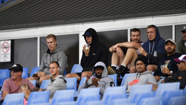 Solidarity: Manly players sit together, even as their club seems to be falling apart.