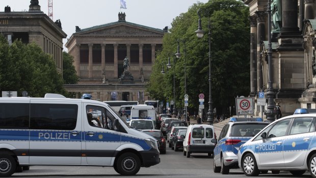 Police vehicles stand in front of Berlin Cathedral, after the attack.