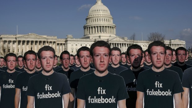 Cardboard cut outs of Mark Zuckerberg welcome him to the US Capitol where he testified for five hours on Tuesday.