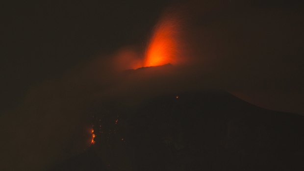 The Volcano of Fire spews molten rock from its crater in Alotenango, Guatemala.