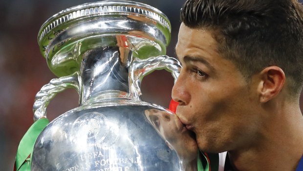 Proven winner: Ronaldo kisses the European Championship trophy.