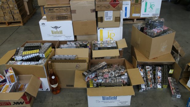 Police seized a large number of cigarettes, alcohol, documents and computers.