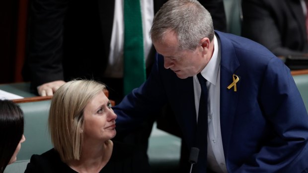 Lamb is comforted by Opposition Leader Bill Shorten.