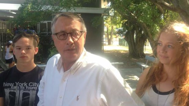 Former deputy prime minister and treasurer Wayne Swan casts his vote at the Kedron State School in his seat of Lilley with his son Matt, 18, and daughter Libbi, 24.